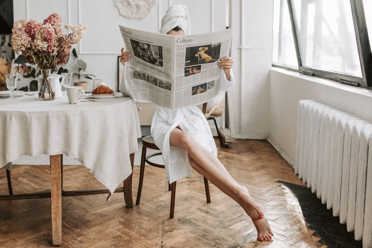 A women reading a Newspaper
