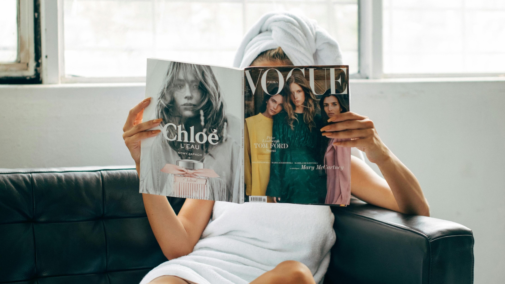 A women reading Vogue Magazine