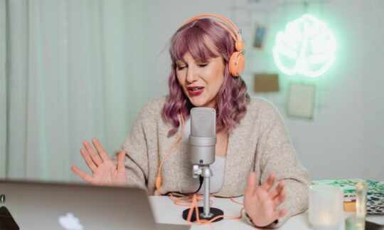 An artist reading Billboard Magazine online