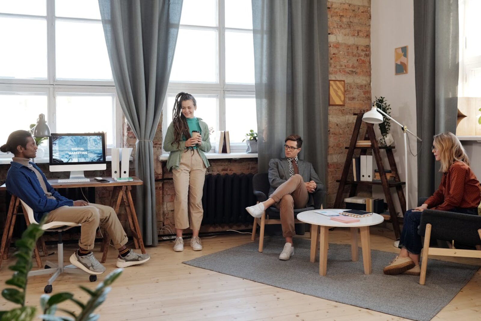 Business professionals in Canada reviewing a press release strategy and distribution plan on a laptop.